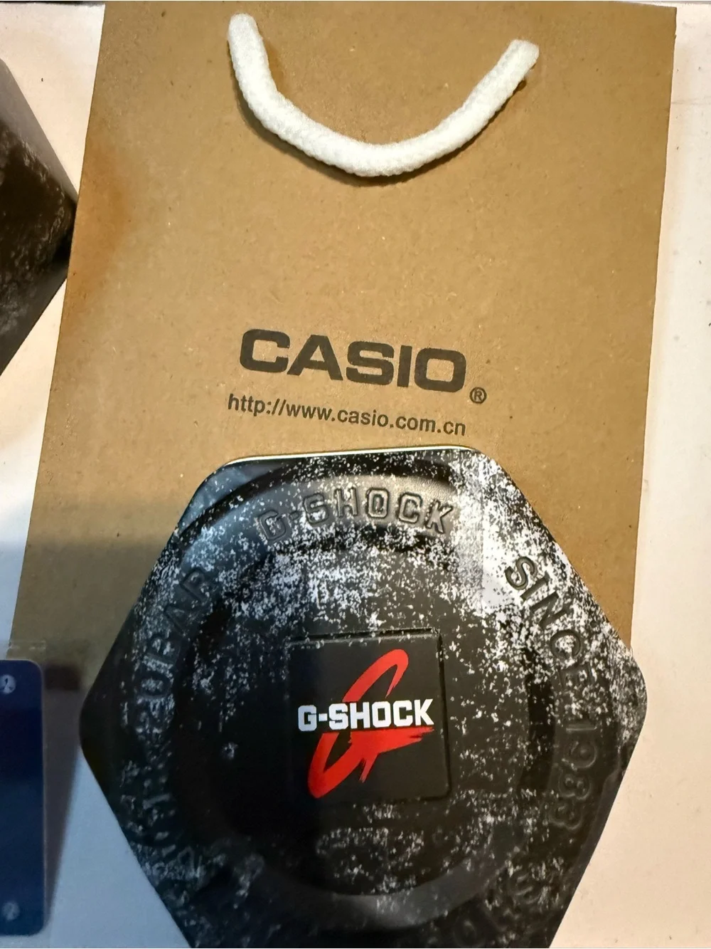 Casio G-SHOCK Warranty Card with Red and Blue Accents
